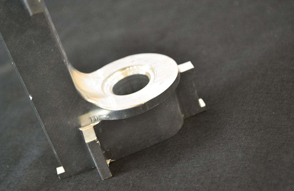 What is the principle of CNC machining?